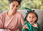 Portrait of mother and child playing, having fun with costume and bonding on a sofa at home. Fantasy, game and creative parent enjoying a playful activity with her daughter, smile and relax together