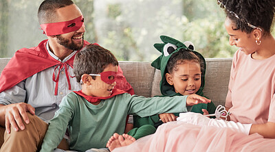 Buy stock photo Family, children and halloween with kids and parents in costume while sitting on a sofa in the living room of their home. Love, imagination and celebration with a brother and sister dressing up
