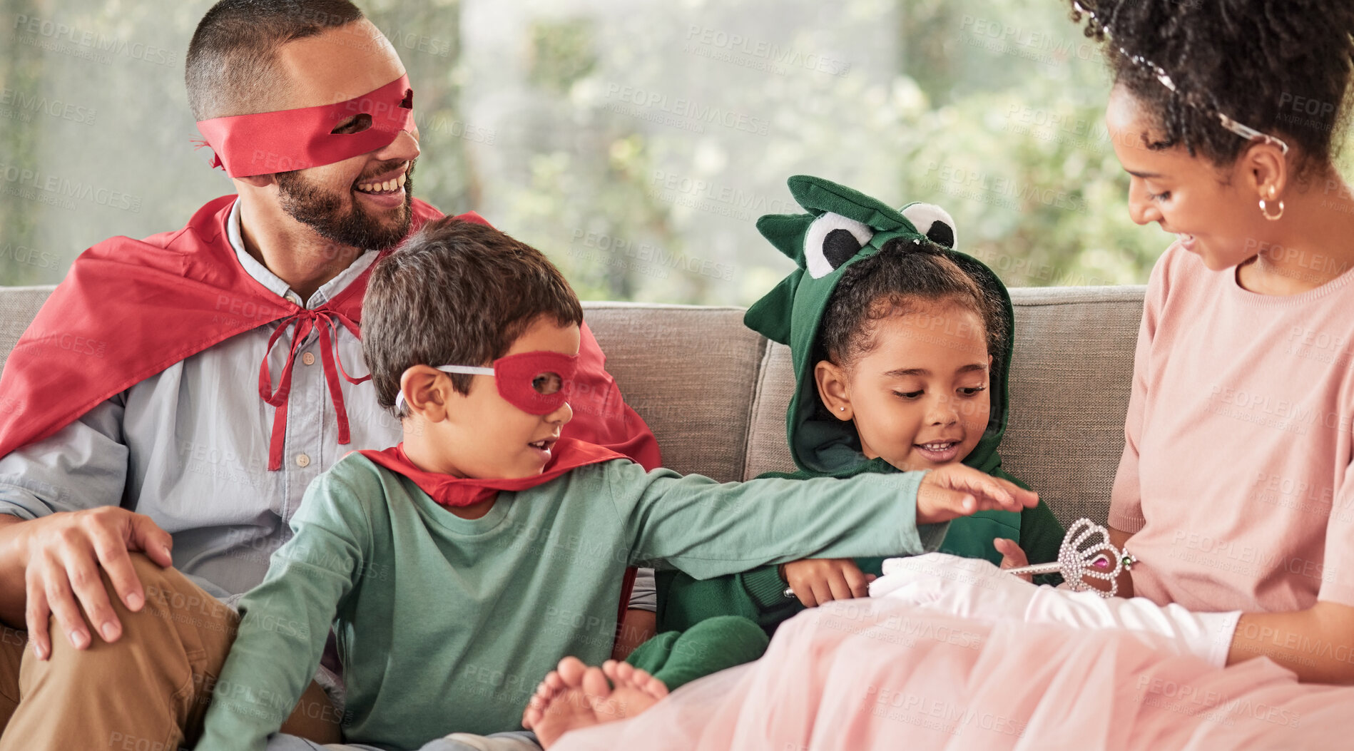 Buy stock photo Family, children and halloween with kids and parents in costume while sitting on a sofa in the living room of their home. Love, imagination and celebration with a brother and sister dressing up