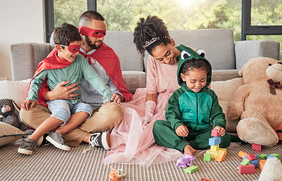 Buy stock photo Happy family, superhero costume and toys in living room, kids playing and having fun together. Love, creative children outfit for halloween or fantasy game with caring dad, mom and children bonding.