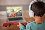 Education, laptop and child with guitar learning how to play on remote lesson, e learning or streaming tutorial video. Talent, online musician course or creative kid study music with teacher or coach