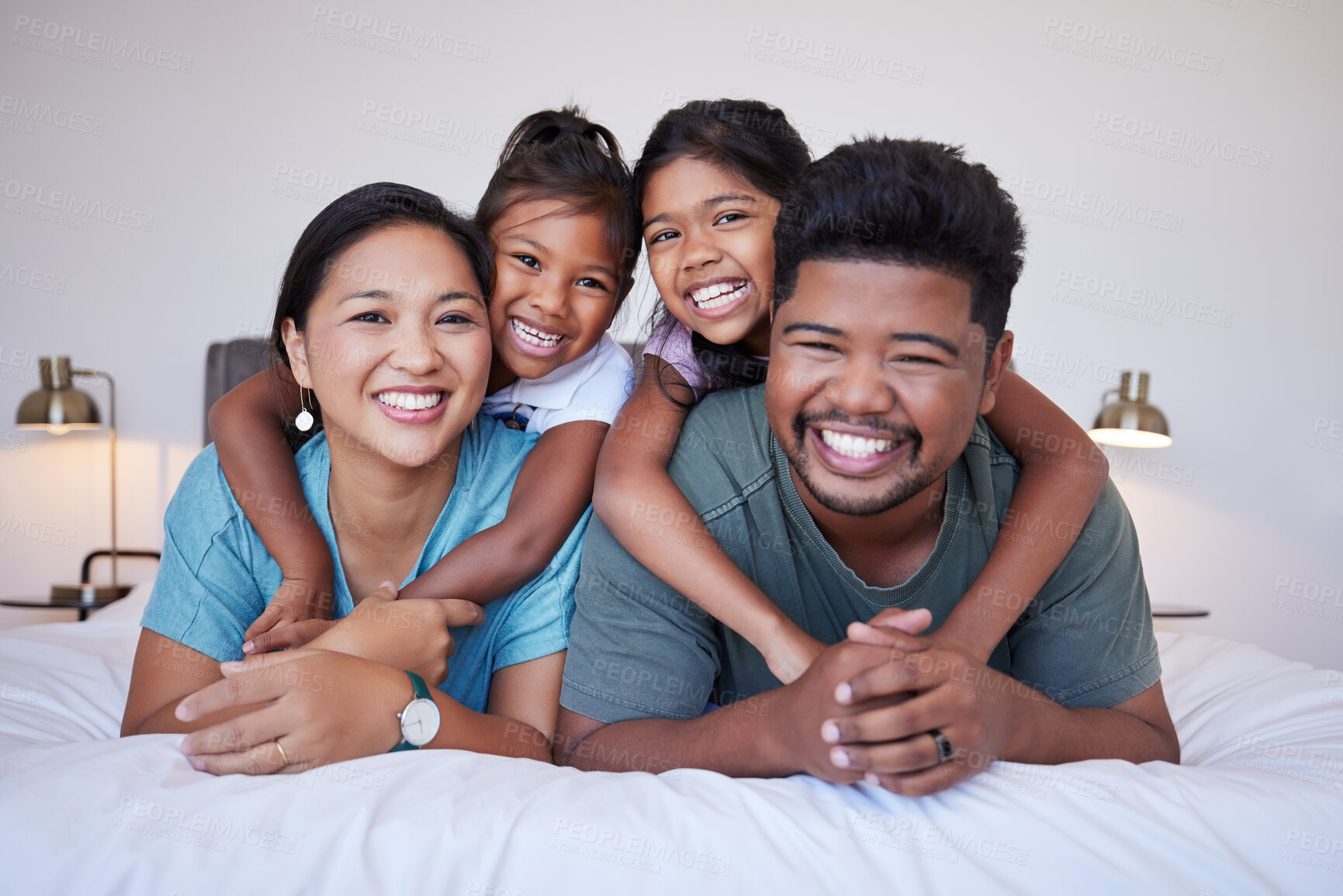 Buy stock photo Family, children and smile on bed for happy portrait together in house or bedroom. Mom, dad and kids in room, show love and happiness in while on holiday, vacation or own home in Jakarta, Indonesia