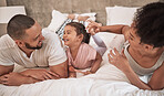 Happy, black family and bed time of parents and a child with a smile in a home bedroom together. Mother, man and young kid laughing and bonding with happiness and fun in a house at night or morning