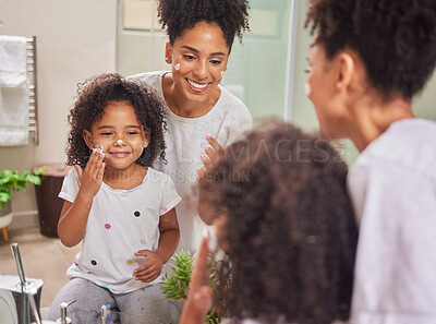 Buy stock photo Happy, mother and child with skincare cream in morning routine together for clean and healthy face at home. Smile, fun and beauty of mom in wellness with her baby girl applying lotion to facial skin