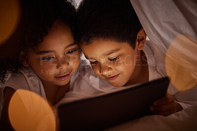 Buy stock photo Children, digital tablet and streaming movies on internet in fun blanket fort at home at night. Happy, boy and girl kids playing and enjoying online games together with subscription on mobile device.