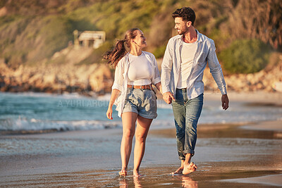 Buy stock photo Love, travel and happy with couple at the beach holding hands on Cancun summer vacation for relax, peace and support. Sunset, ocean and smile with man and woman walking on Mexico holiday together