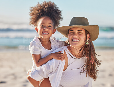 Buy stock photo Mom, girl and beach bonding in carrying game by sea or ocean in Mexico for summer family holiday. Portrait, smile or happy woman, mother or parent with afro child, kid or daughter in nature landscape