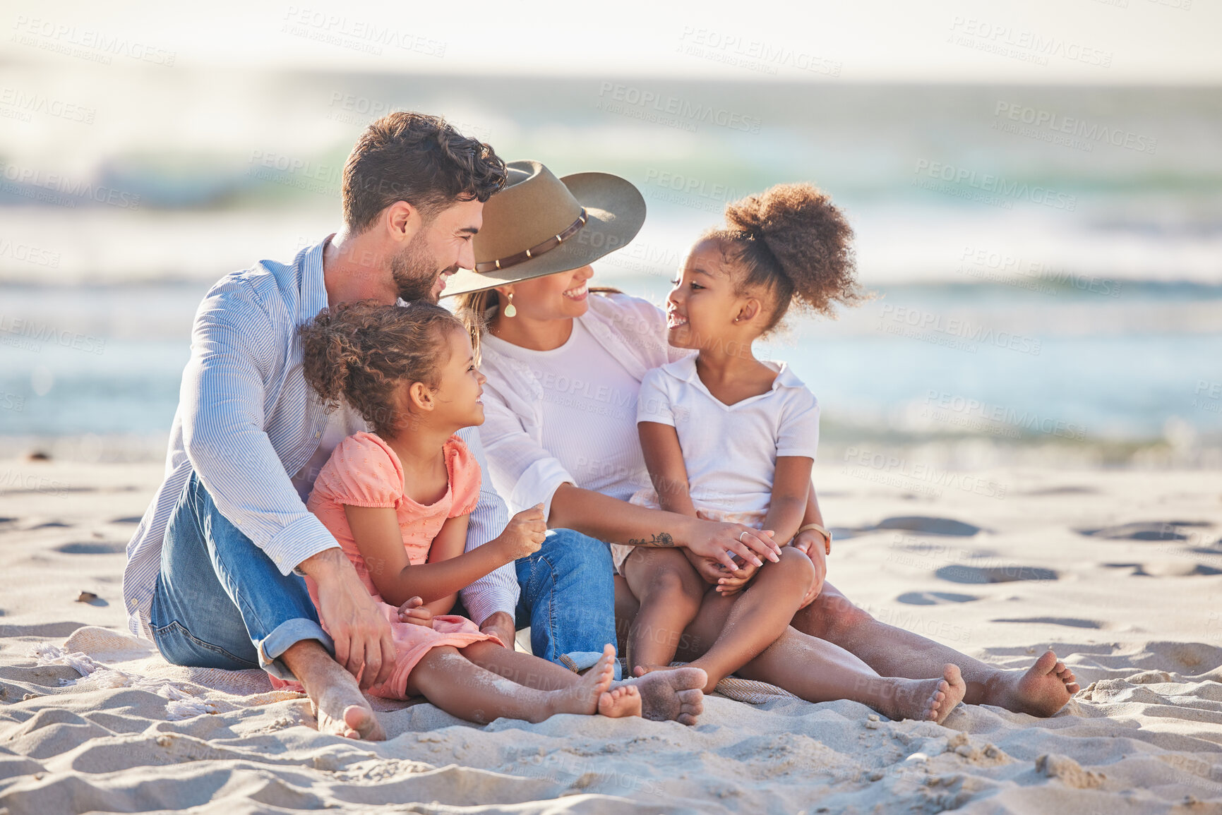Buy stock photo Parents, kids and beach sand vacation, family holiday and summer sea travel together in Portugal. Smile mom, love dad and happy young girl children, relax and quality time in sunshine ocean outdoors