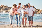 Happy family, portrait and beach summer vacation with happy people bonding on ocean trip. Freedom, love and sea travel with interracial family hug, laugh and walking in nature with excited children