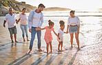 Walking family, beach travel and parents on holiday in nature of Dubai with children and grandparents during summer. Girl kids on walk by the sea with mother, father and senior people with love