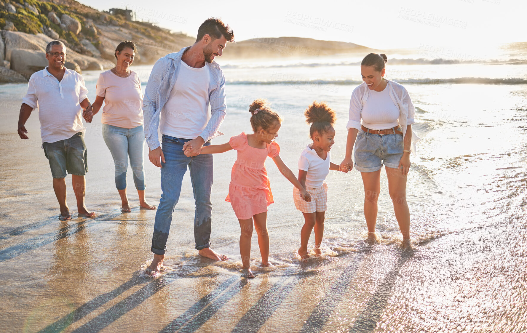 Buy stock photo Walking family, beach travel and parents on holiday in nature of Dubai with children and grandparents during summer. Girl kids on walk by the sea with mother, father and senior people with love