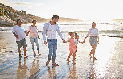 Buy stock photo Big family, beach and summer vacation or travel in Portugal with children, parents and grandparents walking together looking happy and bonding. Men, women and girl kids traveling together at sunset