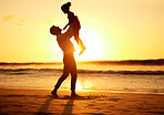 Man, girl and beach at sunset happy, silhouette of dad and child together play on sand. Parent, ocean and sun, rising or setting over the horizon in nature, on vacation or family travel by the sea