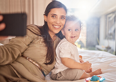 Buy stock photo Smile, selfie and phone with mother and baby relax in bedroom for happy, digital and social media. Family, internet and love with mom and child for memory, lifestyle and wellness at home together