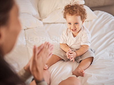 Buy stock photo Baby, family and child clapping hands, happy and having fun on bed playing with his mother at home. Cute kid, son or toddler boy clap for mobility development and bonding while laughing with woman 