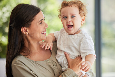 Buy stock photo Love, happy and mother with adoption baby relaxing in interracial family home to bond together. Care, support and joy of Brazilian mom smiling while holding foster child in arms at house.

