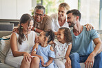 Big family, children and bonding seniors on living room sofa in house or home for mothers day, good news and pregnancy announcement. Smile, happy or excited kids with mom, dad or grandparents support