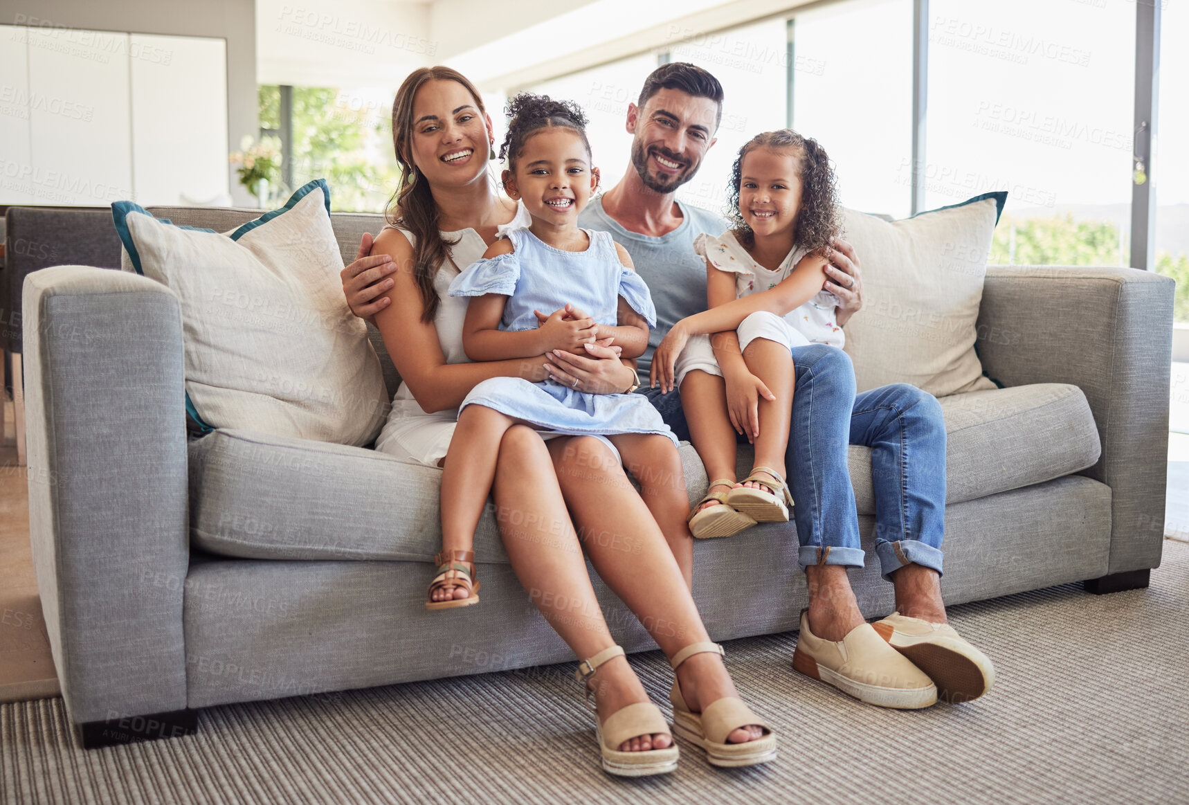 Buy stock photo Parents, kids and happy family home portrait on living room sofa, couch and lounge to relax, quality time and fun together in Spain. Smile mom, dad and young girl children with love, support and care