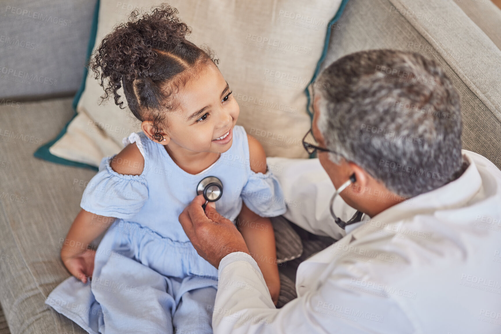 Buy stock photo Home consultation, child and pediatrician with stethoscope doing health check on happy kid patient. Happiness, smile and young girl with medical healthcare worker or medicine doctor doing heart exam