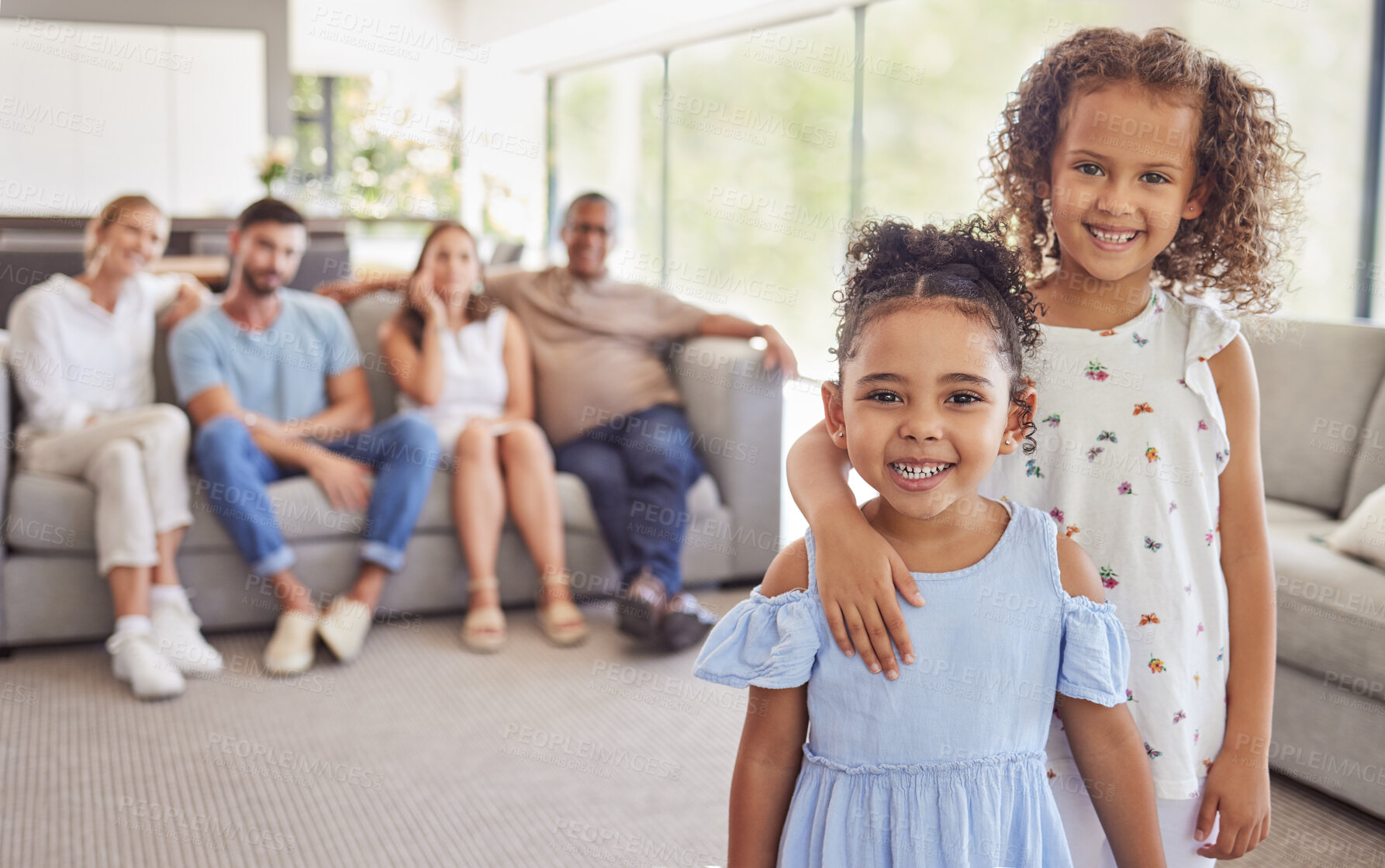 Buy stock photo Girl, kids and smile in home living room on holiday together with parents blurred in family portrait. Friends, cousin and family in lounge happy embrace with mother and dad on sofa behind in Toronto