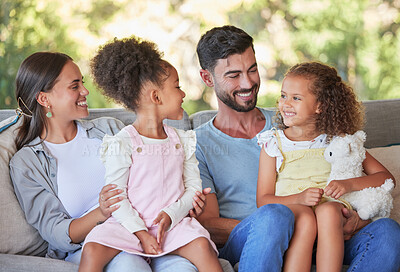 Buy stock photo Happy family, parents and girl children on sofa bonding, love affection and care together at family home. Mom, father and young kids relax, smile and happiness sitting on lounge enjoy quality time