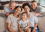 Happy family of couple, grandparents and child on sofa in living room happy for love, care and reunion at family home. Big family visit or people together smile, excited and happiness in house lounge