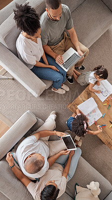 Buy stock photo Big family, home and technology with parents streaming internet and children doing art and drawing while sitting in the lounge at home from above. Busy men, women and kids enjoying fun activities