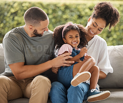 Buy stock photo Child portrait, playing family and parents with love and smile for happy girl on living room sofa in house together. Comic mother, father and young kid being crazy on the couch in the lounge of home