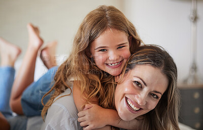 Buy stock photo Relax, hug and portrait of mother with child in New Zealand family home enjoy bonding together. Care, love and happy mother smiling with young daughter in house on weekend for leisure time.

