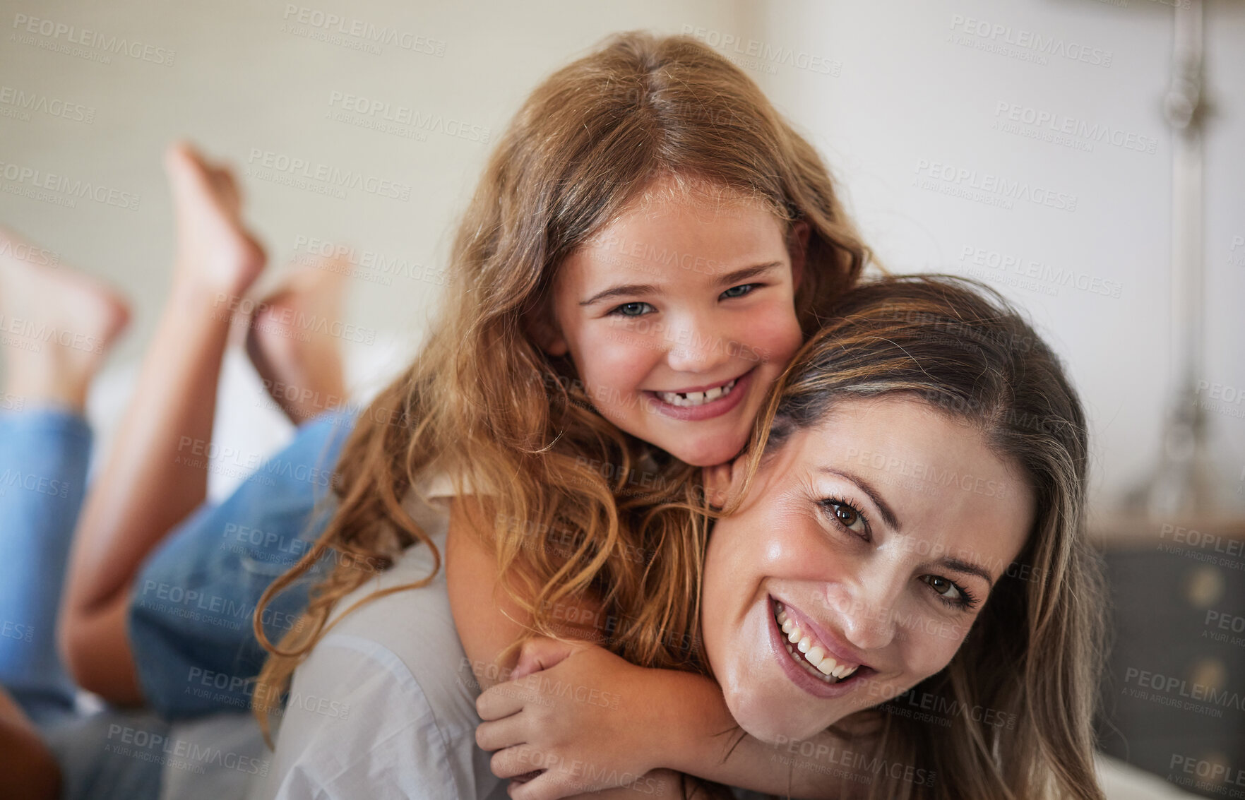 Buy stock photo Relax, hug and portrait of mother with child in New Zealand family home enjoy bonding together. Care, love and happy mother smiling with young daughter in house on weekend for leisure time.

