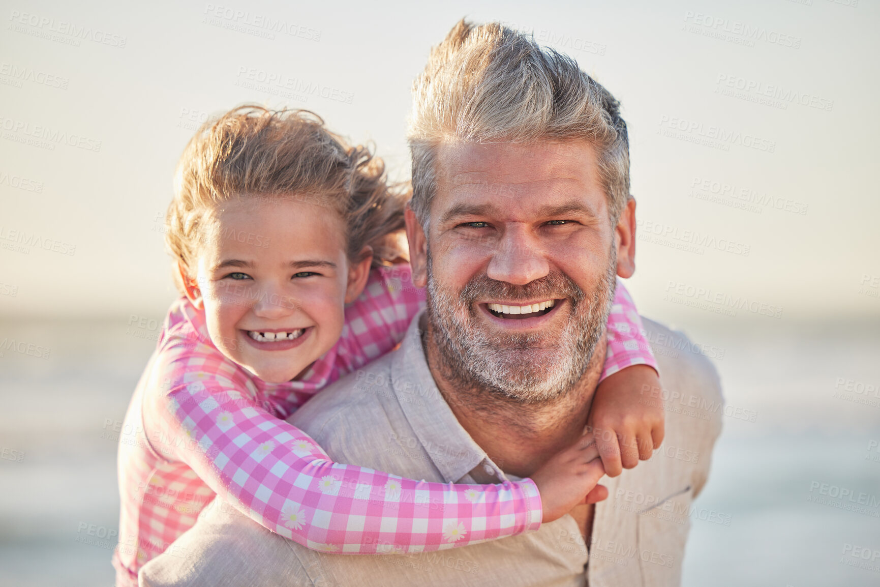 Buy stock photo Happy, father and girl being on back smile, laugh and playing together outside on trip. Parent, kid and child fun, enjoy and relax being playful and bonding on weekend, holiday and vacation at beach 