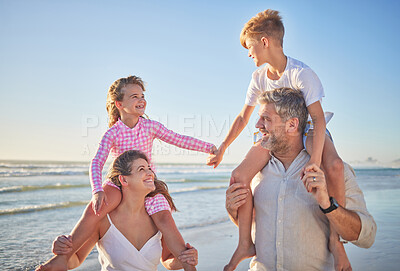 Buy stock photo Travel, relax and happy with family at beach and holding hands on vacation for trust, summer or freedom. Support, motivation and smile with children on parents shoulders and walking on Hawaii holiday