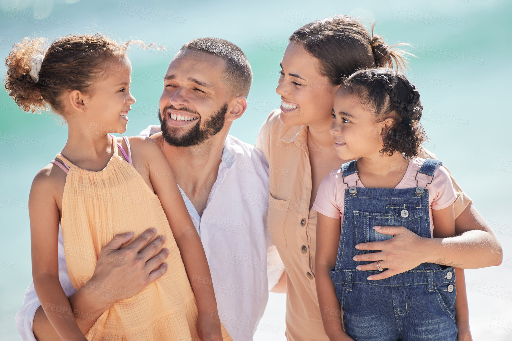 Buy stock photo Happy family, travel and beach holiday with kids in Costa Rica, summer vacation or trip outdoors. Love, smile and girls, mom and dad together on ocean or sea shore spending time bonding and caring.