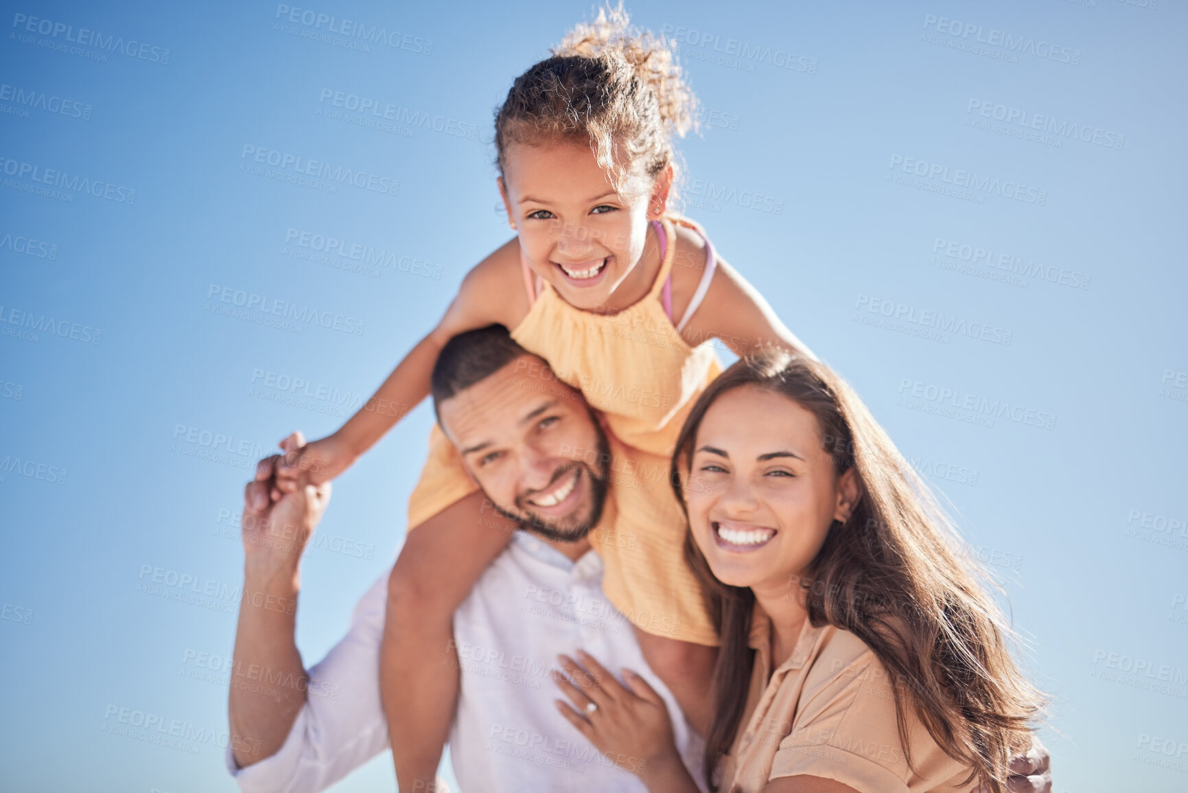 Buy stock photo Parents, child and happy with sky in for portrait of family together outside on vacation. Mom, dad and girl on shoulders, love and happiness outdoors with blue sky while on holiday or travel