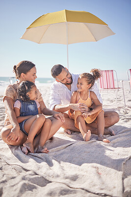 Buy stock photo Family, happy and ocean summer experience of a mother, man and children enjoying the sea on sand. Happiness smile of kids and people together with quality time sitting in nature with a beach umbrella
