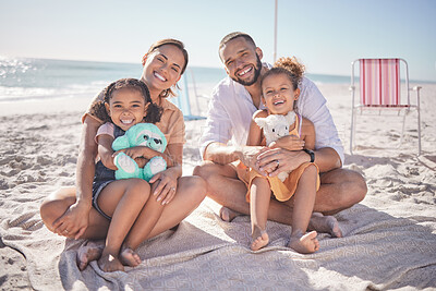 Buy stock photo Family, kids sitting on sand on beach holiday, vacation and trip smile, happy and relax. Love, parents and children with toys close to seaside on the weekend for fun, enjoyment and a break in summer.