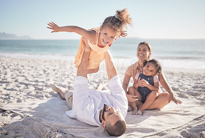 Buy stock photo Family, children and playing with a girl on a beach holiday with her parents and sister during summer. Kids, travel and ocean with a female child or daughter on the sand by the sea with her father