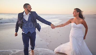 Buy stock photo Beach wedding, marriage celebration and couple holding hands while walking by the sea after love event with bride and groom in nature. Man and woman on walk by the ocean after ceremony with smile