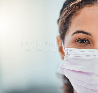 Buy stock photo Covid, mockup and face with a woman in a mask during the pandemic for healthcare marketing or advertising. Closeup portrait of an attractive young female covering her mouth during the corona virus