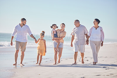 Buy stock photo Family, love and beach with a girl, grandparents and parents walking on the sand with a view of the sea or ocean and sky. Love, travel and summer with a man, woman and daughter happy on vacation