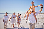 Beach, family and children with grandparents walk on sand close to shoreline for relax, bonding and fun. Happy, parents and kids being playful, smile and enjoy the sunny day in summer on a vacation. 