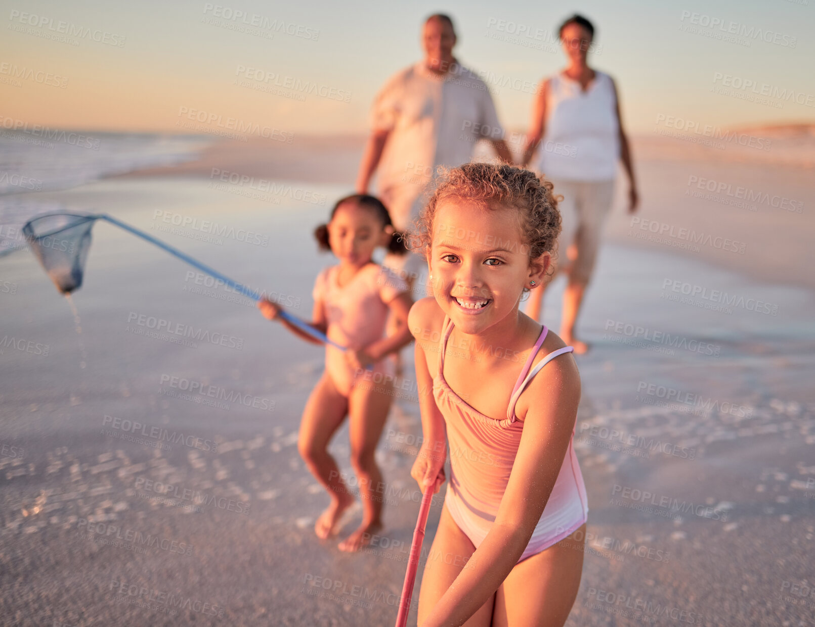 Buy stock photo Children, fishing and family with a girl at the beach with her grandparents and sister for summer holiday. Kids, happy and ocean with a child on sand by the sea with her grandmother and grandfather