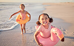 Happy, healthy children running on the beach for summer outdoor holiday, growth development and vitamin d. Excited girl kids with happy portrait run and play together by the ocean or sea waves