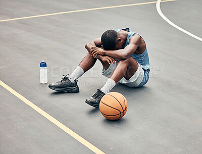 Buy stock photo Basketball man, sports burnout and game fatigue on court sport training, muscle injury from exercise on ground and sad with mistake. Sick, depressed and african american athlete with competition pain