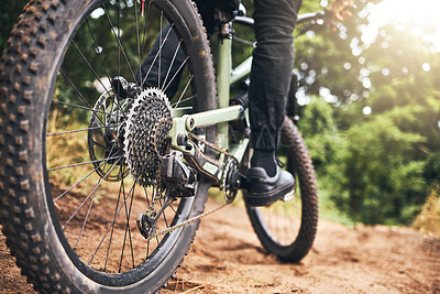 Buy stock photo Bicycle, forest and wheels on a dirt road trail for fitness, adventure workout and exercise. Closeup of a sports bike, outdoor sand track and tire with an athlete cycling in nature for fun and health