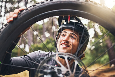 Buy stock photo Bicycle, cycling and man check tire quality, pressure or stability for nature travel, exercise or fitness training. Mountain bike sports person checking wheel for health workout in Canada forest park