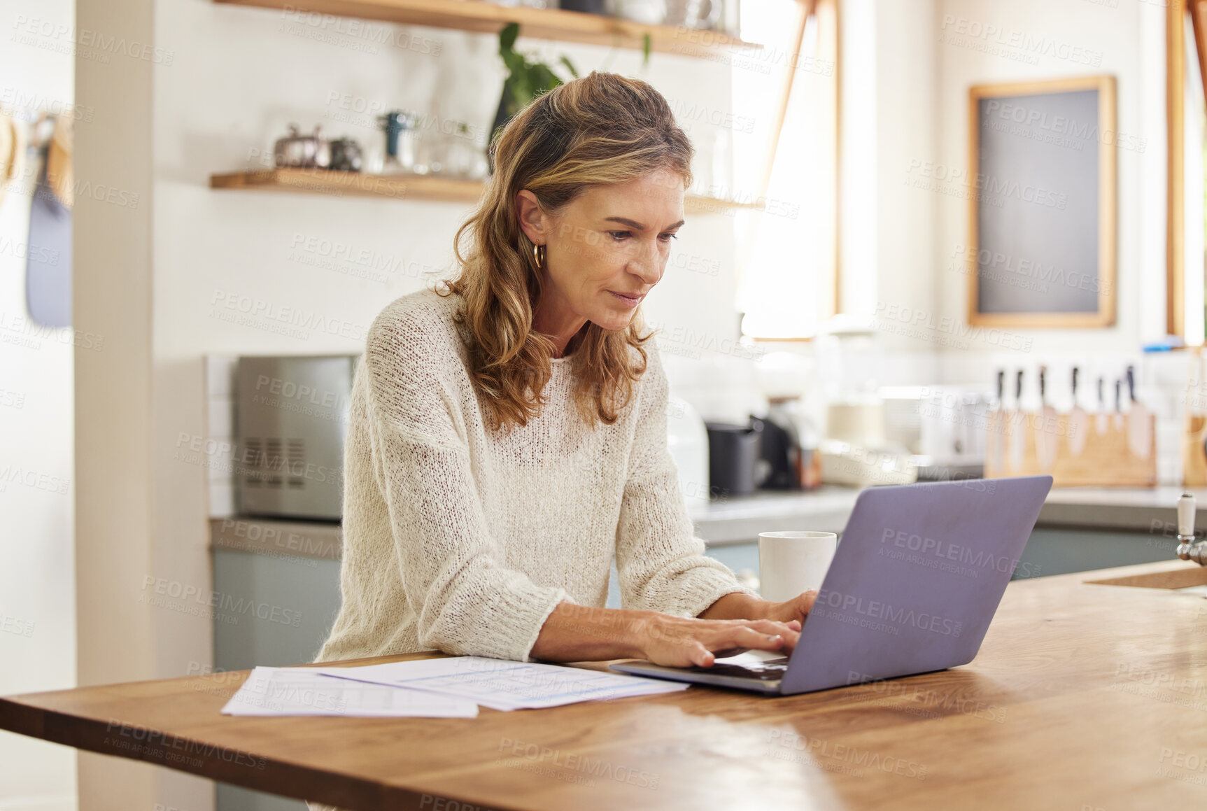 Buy stock photo Mature woman, laptop and work in home for remote job, or online freelance. Lady, computer and paper in house work on email, social media or report for business on the internet with pc on table