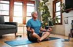 Senior man, yoga meditation and home workout in lotus pose for fitness, peace and zen energy. Calm mindset, focus wellness and healthy retirement on living room floor for balance, breathing and relax