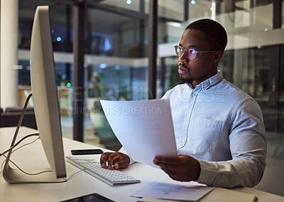 Buy stock photo Contract, documents and data with a businessman working at night on a computer in an office. Research, reading and information with a black male employee at work at a desk on an international company