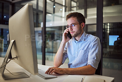 Buy stock photo Business, communication and overtime, phone call and man with computer at desk. Late night at office, working on deal or project. Corporate worker in glasses, typing online and talking on smartphone.